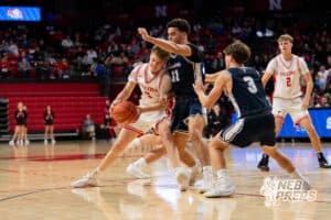 DC West's Trey Olsen (5) drives into Grand Island Central Catholic's Dax Gellatly (11) during a Boys State Championship First Round basketball game Thursday, March 12, 2026, in Lincoln, Nebraska. Photo by Jackson D. Luethje.
