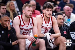 Nebraska Cornhuskers Rienk Mast (51) and Berke Büyüktuncel react to watching the action on the court against the Purdue Boilermakers during the Big Ten Men’s Basketball Championships quarter-final on Friday, March 13, 2026, in Chicago, Illinois. Photo by John S. Peterson.