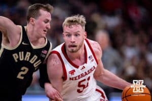 Nebraska Cornhusker forward Rienk Mast (51) drives to the basket against Purdue Boilermaker guard Fletcher Loyer (2) during the Big Ten Men’s Basketball Championships quarter-final on Friday, March 13, 2026, in Chicago, Illinois. Photo by John S. Peterson.