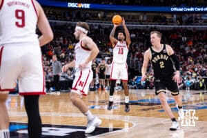 Nebraska Cornhusker guard Jamarques Lawrence (10) makes a three-point basket against the Purdue Boilermakers during the Big Ten Men’s Basketball Championships quarter-final on Friday, March 13, 2026, in Chicago, Illinois. Photo by John S. Peterson.