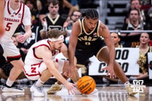 Nebraska Cornhusker guard Sam Hoiberg (1) reaches for the ball against Purdue Boilermaker guard C.J. Cox (0) during the Big Ten Men’s Basketball Championships quarter-final on Friday, March 13, 2026, in Chicago, Illinois. Photo by John S. Peterson.