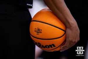 Referee holding the basketball with the Big Ten brand for the game between the Nebraska Cornhuskers and the Purdue Boilermakers during the Big Ten Men’s Basketball Championships quarter-final on Friday, March 13, 2026, in Chicago, Illinois. Photo by John S. Peterson.