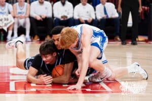 Papillion-La Vista South's Grant Beckenhauer (23) and Kenyen Slobodny (31) dives on the ball with Creighton Prep's Kyle Tubrick (10) during a Boys State Championship First Round basketball game Wednesday, March 11, 2026, in Lincoln, Nebraska. Photo by Jackson D. Luethje.