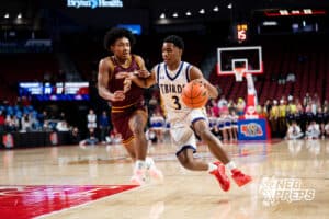 Bellevue West's Bryce Johnson Jr (3) guarded by Papillion-La Vista's Cedric Williams (2) during a Boys State Championship First Round basketball game Wednesday, March 11, 2026, in Lincoln, Nebraska. Photo by Jackson D. Luethje.
