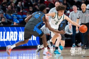 Lincoln Southwest's Uzziah Sanders (2) gaurded by Millard North's Makhi Carodine (10) during a Boys State Championship First Round basketball game Wednesday, March 11, 2026, in Lincoln, Nebraska. Photo by Jackson D. Luethje.