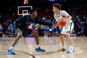 Lincoln Southwest's Makkiah Sanders (10) guarded by Millard North's Trelly Akins (1) during a Boys State Championship First Round basketball game Wednesday, March 11, 2026, in Lincoln, Nebraska. Photo by Jackson D. Luethje.