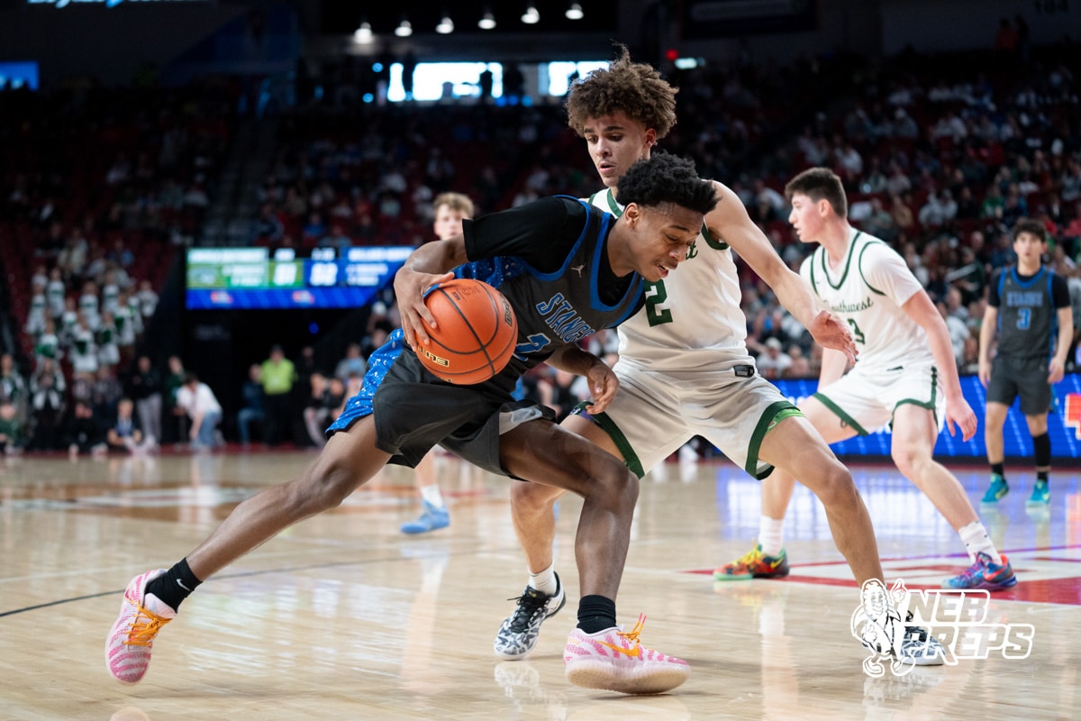 Millard North's Trevor Bailey (2) guarded by Lincoln Southwest's Uzziah Sanders (2) during a Boys State Championship First Round basketball game Wednesday, March 11, 2026, in Lincoln, Nebraska. Photo by Jackson D. Luethje.