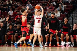 Omaha Westside's Jack Hawkins (2) shoots infront of Lincoln High bench during a Boys State Championship First Round basketball game Wednesday, March 11, 2026, in Lincoln, Nebraska. Photo by Jackson D. Luethje.
