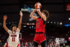 Lincoln High's Jaxyn Cruse (0) shoots a three during a Boys State Championship First Round basketball game Wednesday, March 11, 2026, in Lincoln, Nebraska. Photo by Jackson D. Luethje.