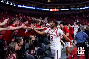 Nebraska Cornhusker guard Kendall Blue (2) gives high fives after the win over the Iowa Hawkeyes during a college basketball game on Sunday, March 8, 2026, in Lincoln, Nebraska. Photo by John S. Peterson.