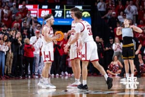 Nebraska Cornhusker Cale Jacobsen (31) gives Sam Hoiberg (1) the ball to finish out the remaining seconds in overtime to win the game against the Iowa Hawkeyes during a college basketball game on Sunday, March 8, 2026, in Lincoln, Nebraska. Photo by John S. Peterson.