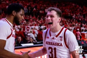 Nebraska Cornhusker guard Cale Jacobsen (31) celebrates the win with Jared Garcia against the Iowa Hawkeyes during a college basketball game on Sunday, March 8, 2026, in Lincoln, Nebraska. Photo by John S. Peterson.