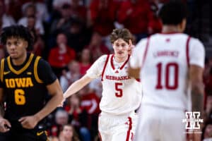 Nebraska Cornhusker forward Braden Frager (5) points to Jamarques Lawrence for the assist against the Iowa Hawkeyes in the second half during a college basketball game on Sunday, March 8, 2026, in Lincoln, Nebraska. Photo by John S. Peterson.
