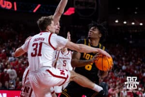Nebraska Cornhusker guard Cale Jacobsen (31) reaches for the ball against Iowa Hawkeye guard Tavion Banks (6) in the second half during a college basketball game on Sunday, March 8, 2026, in Lincoln, Nebraska. Photo by John S. Peterson.
