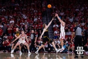 Nebraska Cornhusker forward Pryce Sandfort (21) makes a three-point basket against the Iowa Hawkeyes in the second half during a college basketball game on Sunday, March 8, 2026, in Lincoln, Nebraska. Photo by John S. Peterson.