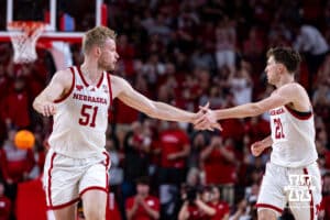 Nebraska Cornhusker forward Pryce Sandfort (21) gives Rienk Mast after making a three-point basket against the Iowa Hawkeyes in the second half during a college basketball game on Sunday, March 8, 2026, in Lincoln, Nebraska. Photo by John S. Peterson.