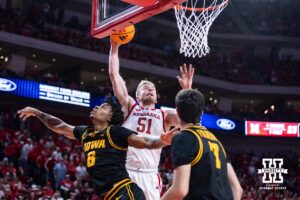 Nebraska Cornhusker forward Rienk Mast (51) dunks the basketball against Iowa Hawkeye guard Tavion Banks (6) in the first half during a college basketball game on Sunday, March 8, 2026, in Lincoln, Nebraska. Photo by John S. Peterson.