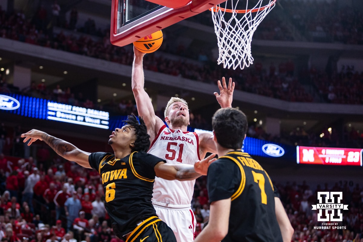 Nebraska Cornhusker forward Rienk Mast (51) dunks the basketball against Iowa Hawkeye guard Tavion Banks (6) in the first half during a college basketball game on Sunday, March 8, 2026, in Lincoln, Nebraska. Photo by John S. Peterson.