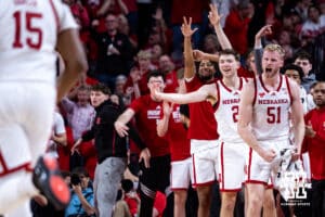 Nebraska Cornhuskers bench celebrates Jared Garcia's three-point basket against the Iowa Hawkeyes during a college basketball game on Sunday, March 8, 2026, in Lincoln, Nebraska. Photo by John S. Peterson.