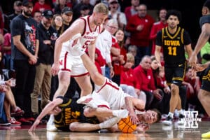 Nebraska Cornhusker forward Pryce Sandfort (21) gets tied up with Iowa Hawkeye guard Bennett Stirtz (14) going after the ball in the first half during a college basketball game on Sunday, March 8, 2026, in Lincoln, Nebraska. Photo by John S. Peterson.