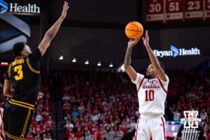 Nebraska Cornhusker guard Jamarques Lawrence (10) makes a three-point basket against the Iowa Hawkeyes in the first half during a college basketball game on Sunday, March 8, 2026, in Lincoln, Nebraska. Photo by John S. Peterson.