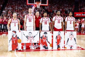 Nebraska Cornhusker seniors Sam Hoiberg, Rienk Mast, Jamarques Lawrence, Jared Garcia, and Kendall Blue, along with coach Fred Hoiberg, pose for a photo during a college basketball game on Sunday, March 8, 2026, in Lincoln, Nebraska. Photo by John S. Peterson.