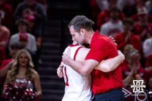 Nebraska Cornhusker senior Sam Hoiberg (1) gives his father a hug on Senior Day during a college basketball game on Sunday, March 8, 2026, in Lincoln, Nebraska. Photo by John S. Peterson.