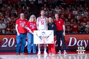 Nebraska Cornhusker forward Rienk Mast (51) poses for a photo with coach Fred Hoiberg and family before taking on Iowa during a college basketball game on Sunday, March 8, 2026, in Lincoln, Nebraska. Photo by John S. Peterson.