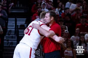 Nebraska Cornhusker senior Rienk Mast (51) gives coach Fred Hoiberg a hug on Senior Day before takingon the Iowa Hawkeyes during a college basketball game on Sunday, March 8, 2026, in Lincoln, Nebraska. Photo by John S. Peterson.