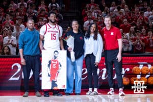 Nebraska Cornhusker senior Jared Garcia (15) poses for a photo with coach Fred Hoiber and family on Senior Day before taking on the Iowa Hawkeyes during a college basketball game on Sunday, March 8, 2026, in Lincoln, Nebraska. Photo by John S. Peterson.