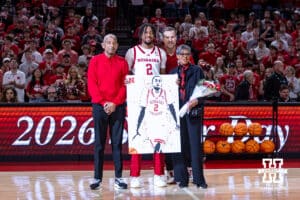 Nebraska Cornhusker senior Kendall Blue (2) poses for a photo with coach Fred Hoiberg and family escorted out on Senior Day before taking on the Iowa Hawkeyes during a college basketball game on Sunday, March 8, 2026, in Lincoln, Nebraska. Photo by John S. Peterson.