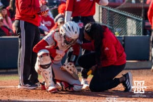 Nebraska Cornhusker catcher Jesse Farrell appears hurt from taking a deflection from the ball during a softball game at Bowlin Field on March 7th, 2026, in Lincoln, Nebraska. Photo by Collin Stilen.