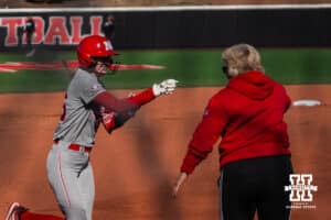 Nebraska Cornhusker Jesse Farrell celebrates her home run during a softball game at Bowlin Field on March 7th, 2026, in Lincoln, Nebraska. Photo by Collin Stilen.