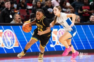 Omaha North's Himayajo Metoyer (24) guarded by Kearney's Hallie Garner (14) during a Girls State Championship Semifinal Round basketball game Friday, March 6, 2026, in Lincoln, Nebraska. Photo by Jackson D. Luethje.