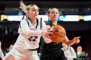 Millard West's Londyn Whitney (3) grabs for a loose ball against Lincoln North Star's Korbyn Pierce (22) during a Girls State Championship Semifinal Round basketball game Friday, March 6, 2026, in Lincoln, Nebraska. Photo by Jackson D. Luethje.