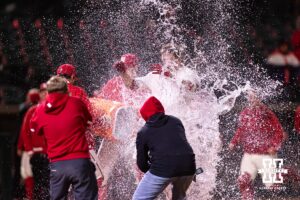 Nebraska Cornhusker Case Sanderson (14) is soaked with water, celebrating the walk-off win over the Michigan State Spartans in the 10th inning during a college baseball game on Friday, March 6, 2026, in Lincoln, Nebraska. Photo by John S. Peterson.