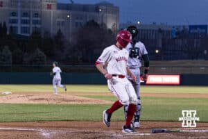 Nebraska Cornhusker Case Sanderson (14) scores from Rhett Stokes single in the eighth against the Michigan State Spartans during a college baseball game on Friday, March 6, 2026, in Lincoln, Nebraska. Photo by John S. Peterson.