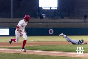 Nebraska Cornhusker Case Sanderson (14) runs home from Rhett Stokes single in the eighth against the Michigan State Spartans during a college baseball game on Friday, March 6, 2026, in Lincoln, Nebraska. Photo by John S. Peterson.