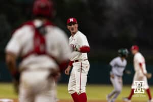 Nebraska Cornhusker pitcher Kevin Mannell (20) congraduates catcher Jeter Worthley (0) for throwing Michigan State Spartan outfielder Khamaree Thomas (21) out at second base during a college baseball game on Friday, March 6, 2026, in Lincoln, Nebraska. Photo by John S. Peterson.