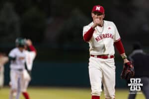 Nebraska Cornhusker pitcher Kevin Mannell (20) gives a fist pump for catcher Jeter Worthley (0) throwing Michigan State Spartan outfielder Khamaree Thomas (21) out at second base during a college baseball game on Friday, March 6, 2026, in Lincoln, Nebraska. Photo by John S. Peterson.