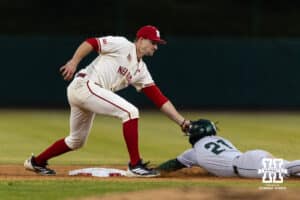 Nebraska Cornhusker infielder Dylan Carey (15) tags Michigan State Spartan Khamaree Thomas (21) out trying to steal second in the eighth during a college baseball game on Friday, March 6, 2026, in Lincoln, Nebraska. Photo by John S. Peterson.