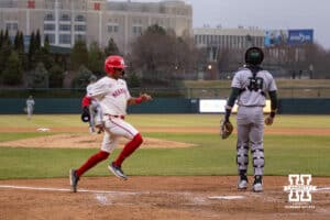 Nebraska Cornhusker catcher Jeter Worthley (0) scores a run from a Moyer single in the seventh against the Michigan State Spartans during a college baseball game on Friday, March 6, 2026, in Lincoln, Nebraska. Photo by John S. Peterson.