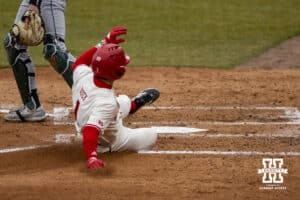 Nebraska Cornhusker Jett Buck (1) slides at home for a run against the Michigan State Spartans in the second inning during a college baseball game on Friday, March 6, 2026, in Lincoln, Nebraska. Photo by John S. Peterson.