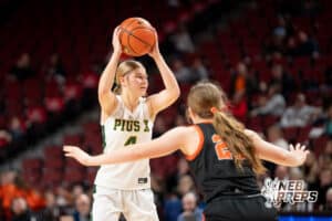 Lincoln Pius X's Kendal Heimes (4) guarded by Beatrice's Tatum Tempelmeyer (20) during a Girls State Championship First Round basketball game Wednesday, March 4, 2026, in Lincoln, Nebraska. Photo by Jackson D. Luethje.