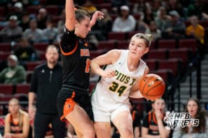 Lincoln Pius X's Emma Oliver (34) guarded by Beatrice's Sophie Gleason (12) during a Girls State Championship First Round basketball game Wednesday, March 4, 2026, in Lincoln, Nebraska. Photo by Jackson D. Luethje.