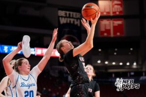 Scottsbluff's Finnley Martin (15) defended by Bennington's Skylar Johnson (20) with shoe in her hand during a Girls State Championship First Round basketball game Wednesday, March 4, 2026, in Lincoln, Nebraska. Photo by Jackson D. Luethje.