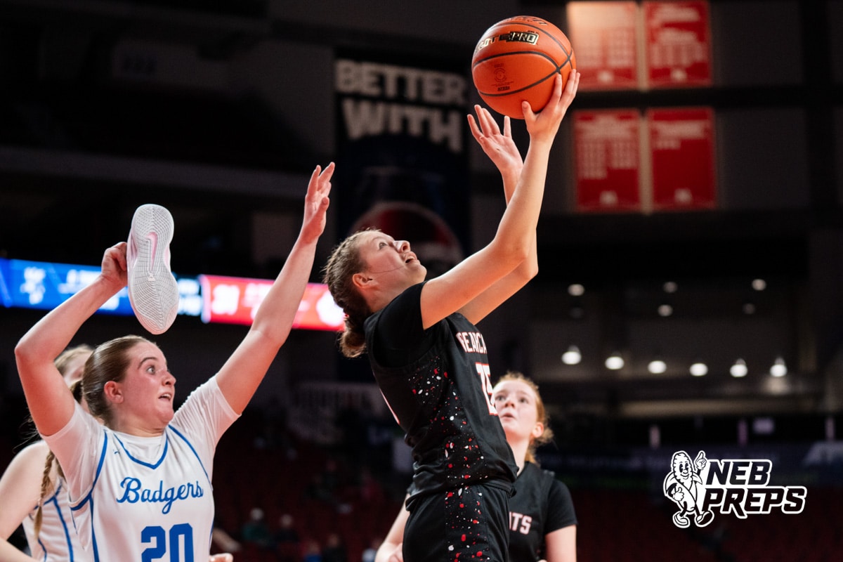 Scottsbluff's Finnley Martin (15) defended by Bennington's Skylar Johnson (20) with shoe in her hand during a Girls State Championship First Round basketball game Wednesday, March 4, 2026, in Lincoln, Nebraska. Photo by Jackson D. Luethje.