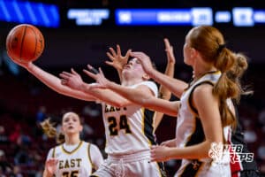 retna East’s Justice Love (24) is laying the ball up through contact during a high school basketball game against Sidney in the first round of the NSAA state girls basketball tournament on March 4, 2026 in Lincoln, Nebraska. Photo By Jack Stephens.