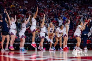 Norris’ bench is celebrating after their teammate made a three point shot during a high school basketball game against Blair in the first round of the NSAA state girls basketball tournament on March 4, 2026 in Lincoln, Nebraska. Photo By Jack Stephens.