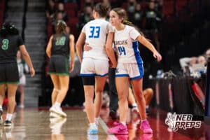 Kearney's Libby Province (33) and Hallie Garner (14) embrace during a Girls State Championship First Round basketball game Wednesday, March 4, 2026, in Lincoln, Nebraska. Photo by Jackson D. Luethje.